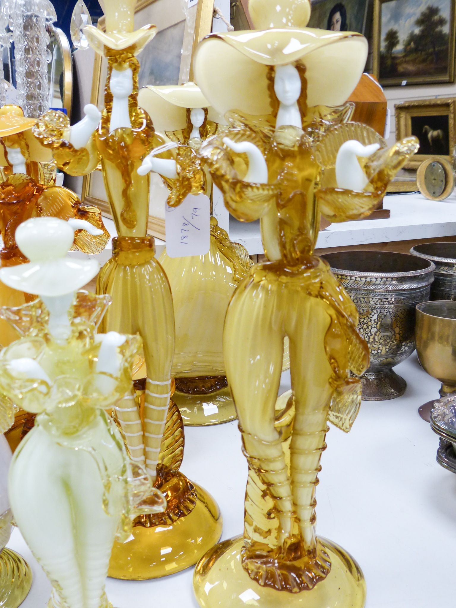 A collection of eight Murano amber glass figures, tallest 42cm